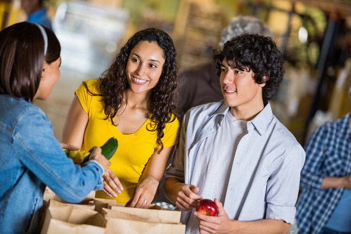 Teens working at a food donations center
