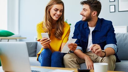 Young couple reviewing finances online