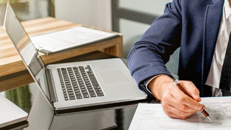 Man in suit working at desk