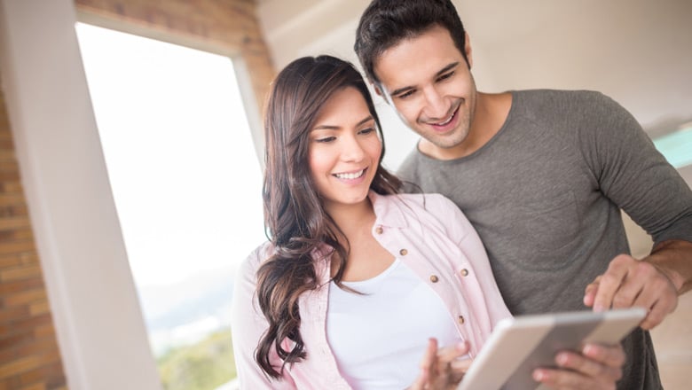 couple looking at tablet