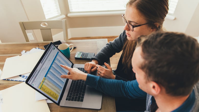 Young couple reviewing finances online