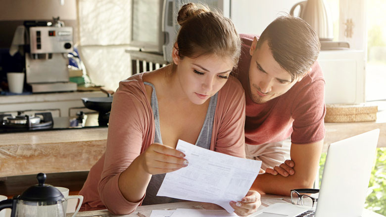 Man and Woman reviewing papers
