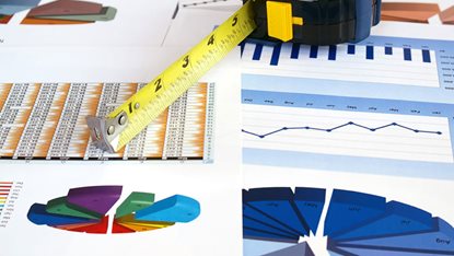 charts and tape measure on a table