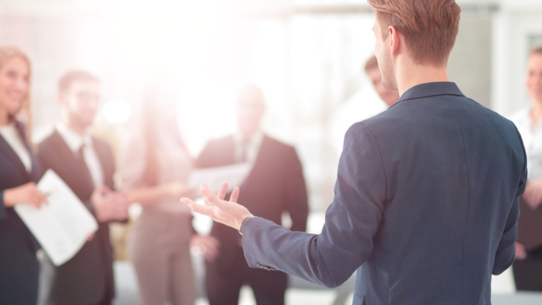 business man talking to a group of people
