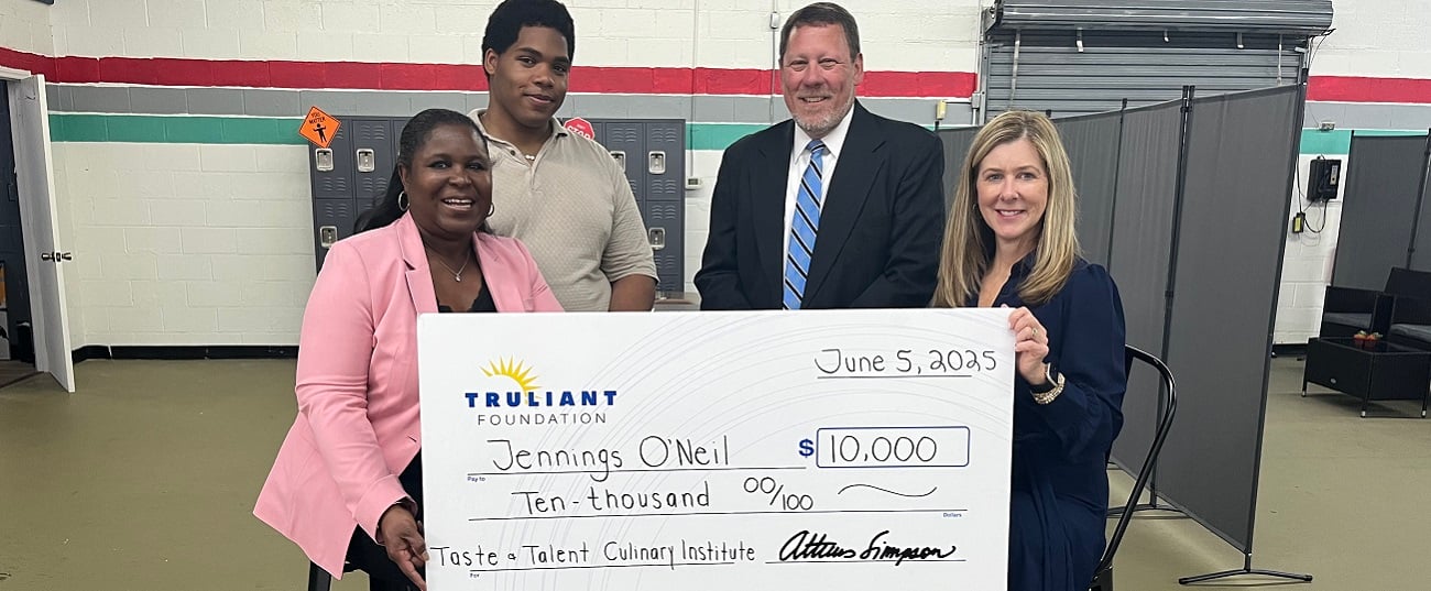 Truliant presenting check to local charity