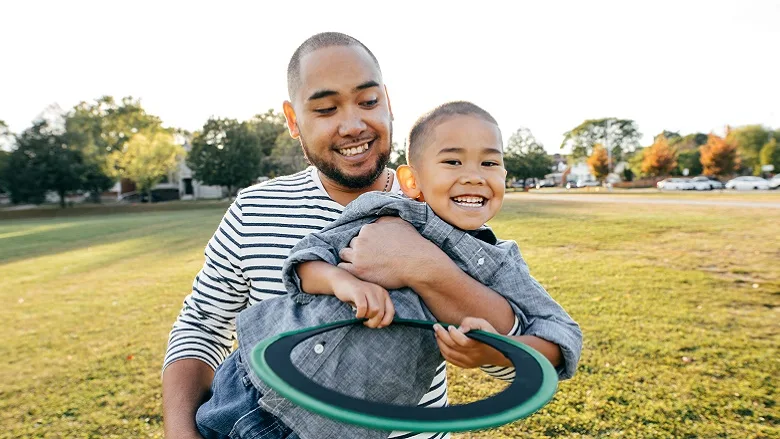 Father and son playing