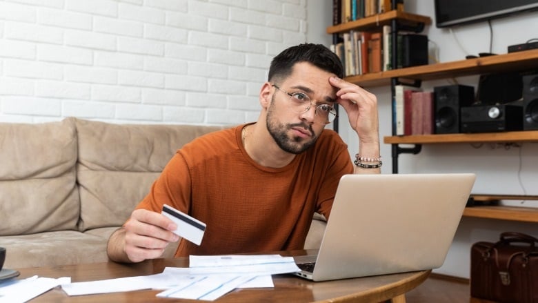 man stressed paying bills
