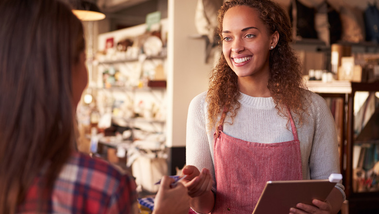 lady barista getting paid for coffee