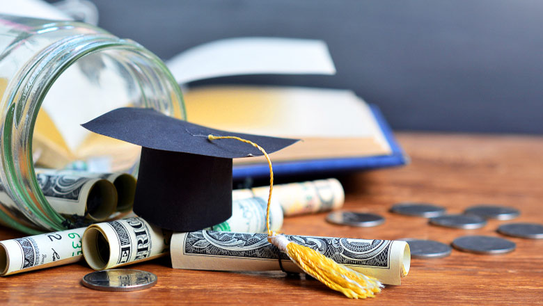 College cap and money on a table