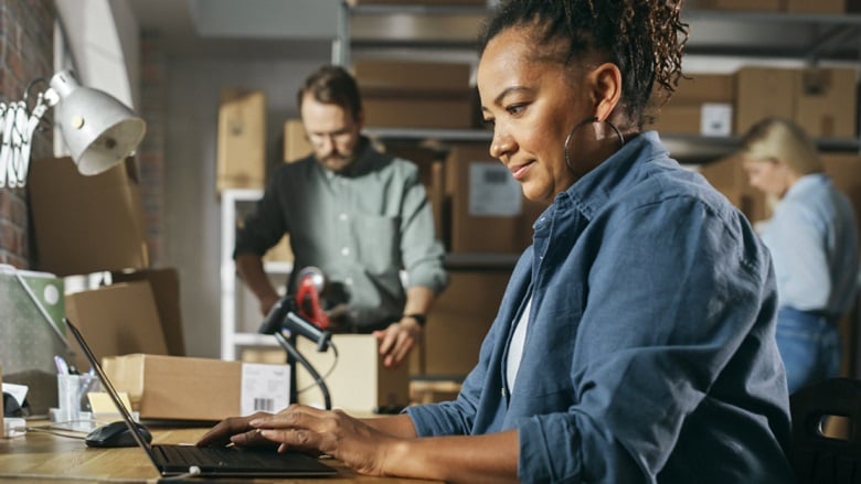 Business owner at work on a laptop