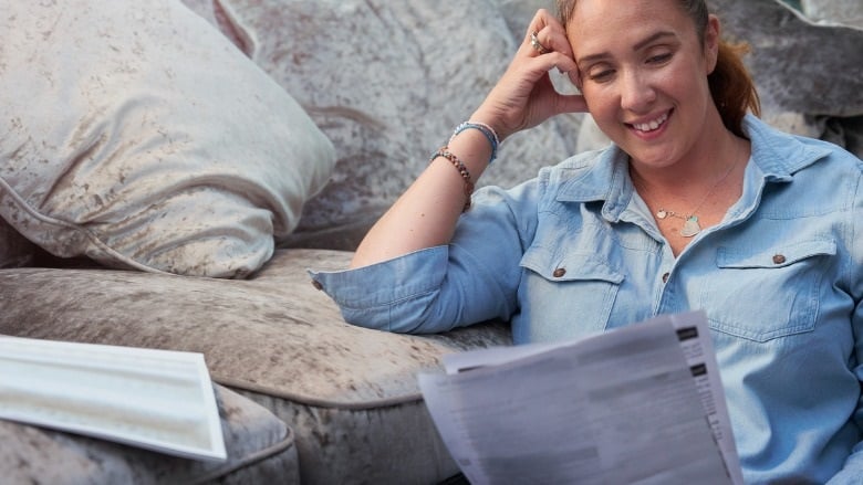 woman reading a bank statement