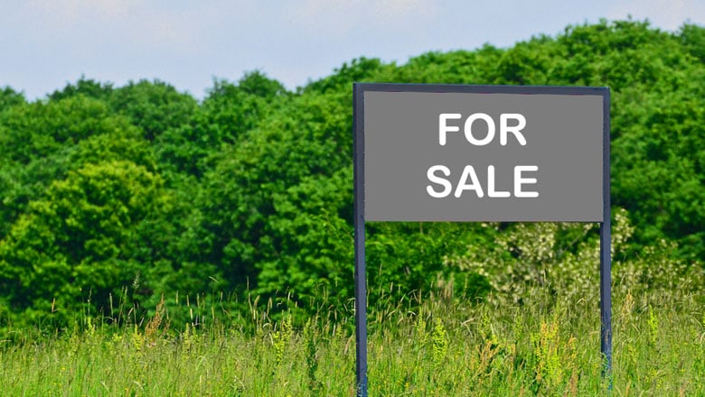 For sale sign on some land
