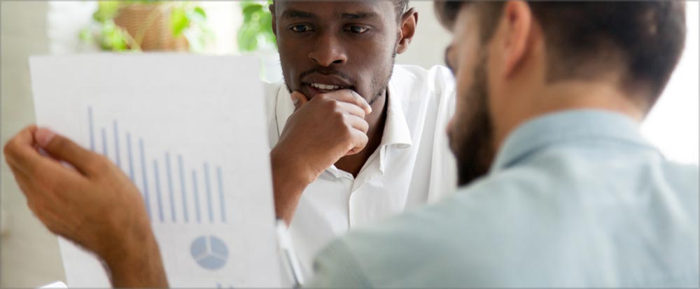 Two men reviewing data in credit report