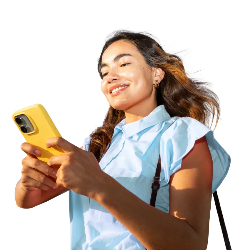 smiling woman using yellow mobile phone