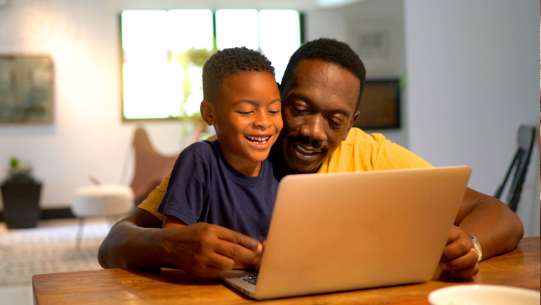 man helping his child study