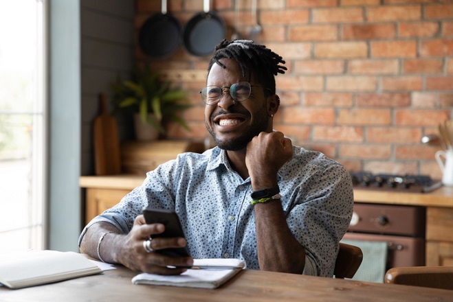 Happy man with his phone