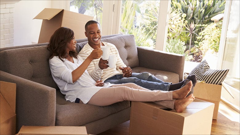 Couple enjoying coffee in a new home