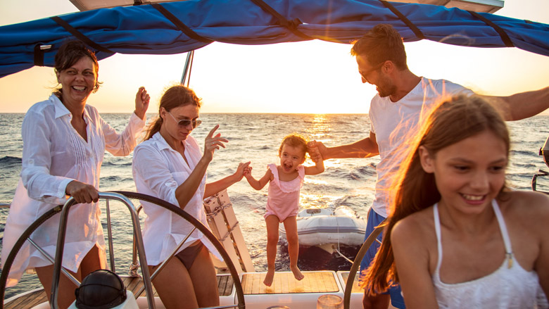 Kids jumping off boat into water