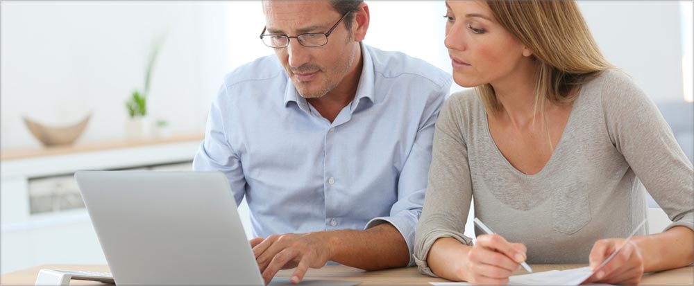 Couple looking at a laptop