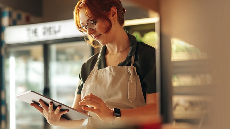 Woman business owner with a laptop