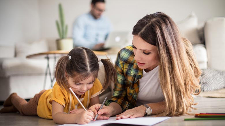 Mom and daughter enjoying coloring together
