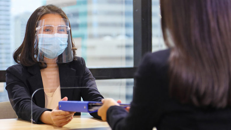Members with masks in branch social distancing