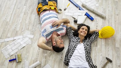 couple resting from a home improvement project