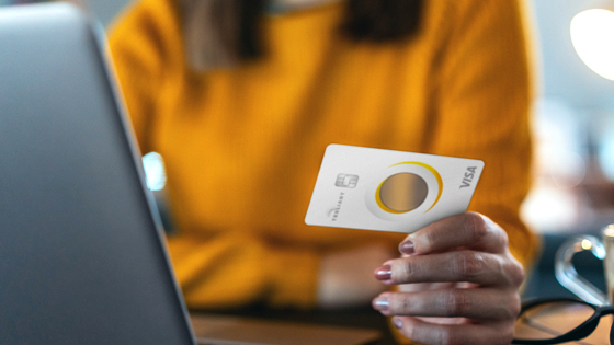Woman holding Truliant Transparent credit card
