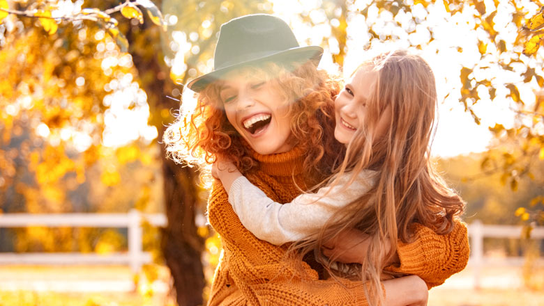 Mom and daughter enjoying a brisk, fall day