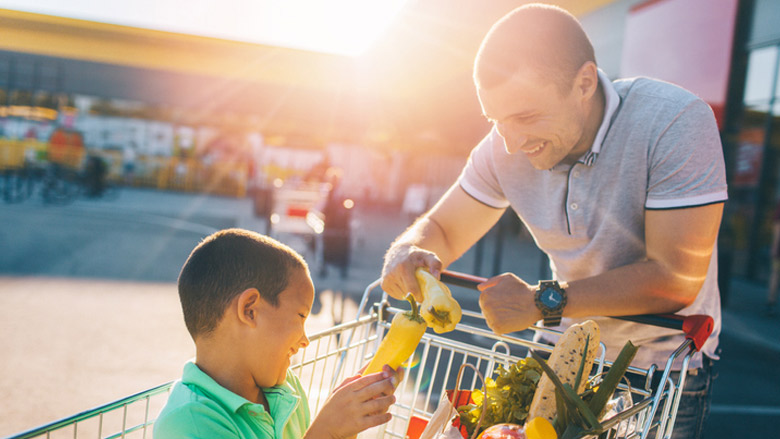 Father and son grocery shopping stress free