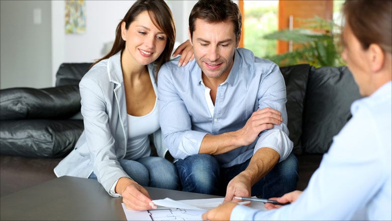 Couple looking at REALTOR® paperwork