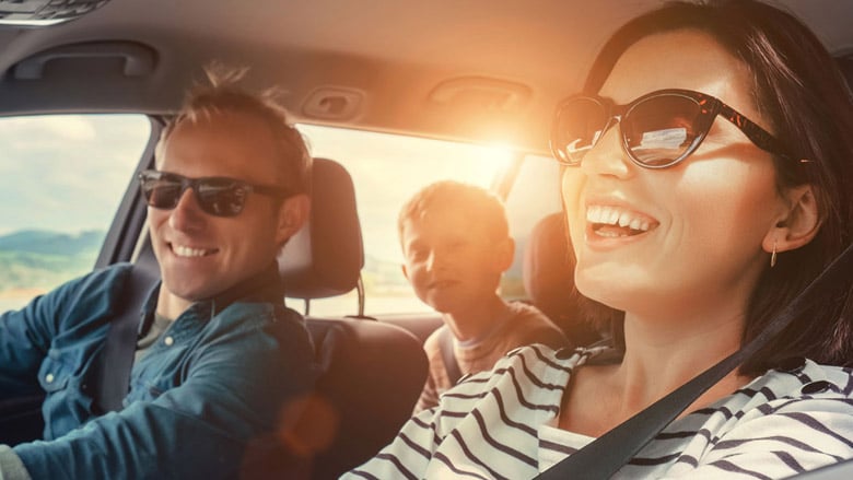 Family in car with sunbeam