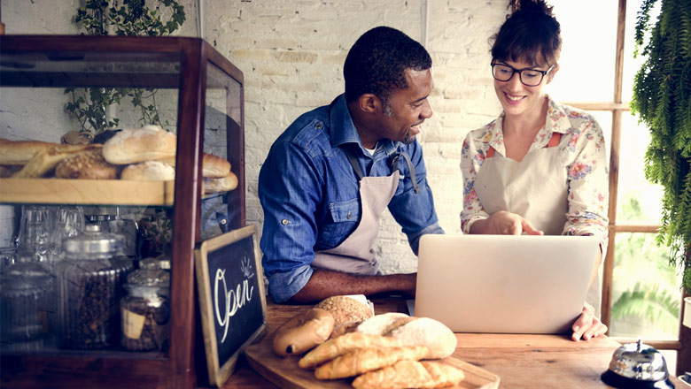 Two small business owners in bakery