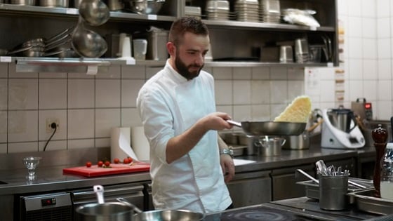 Man cooking in a restaurant kitchen