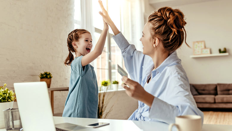 Mom high fiving with daughter