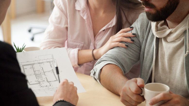 Couple talking to contractor