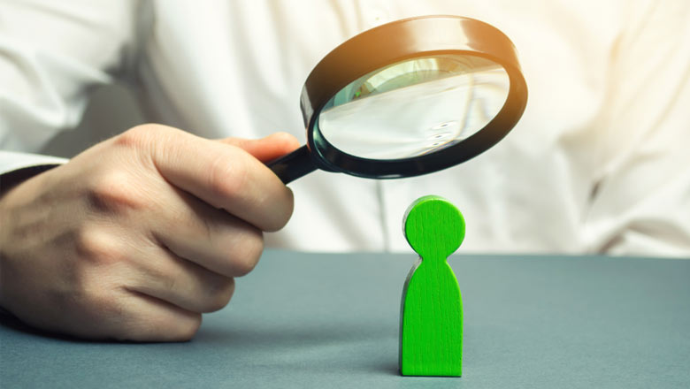 man holding magnifying glass