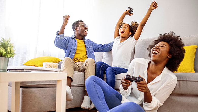 Family having fun playing video games together.