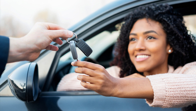 Getting the keys to her new car.