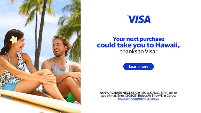 couple sitting on beach in Hawaii