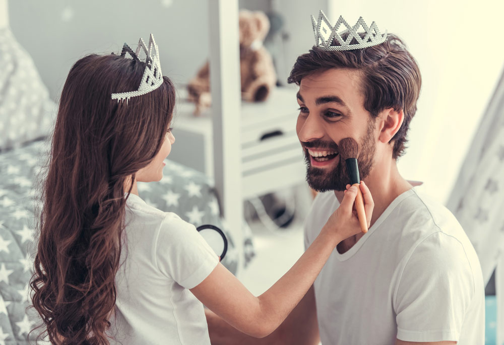 dad and young daughter playing princess