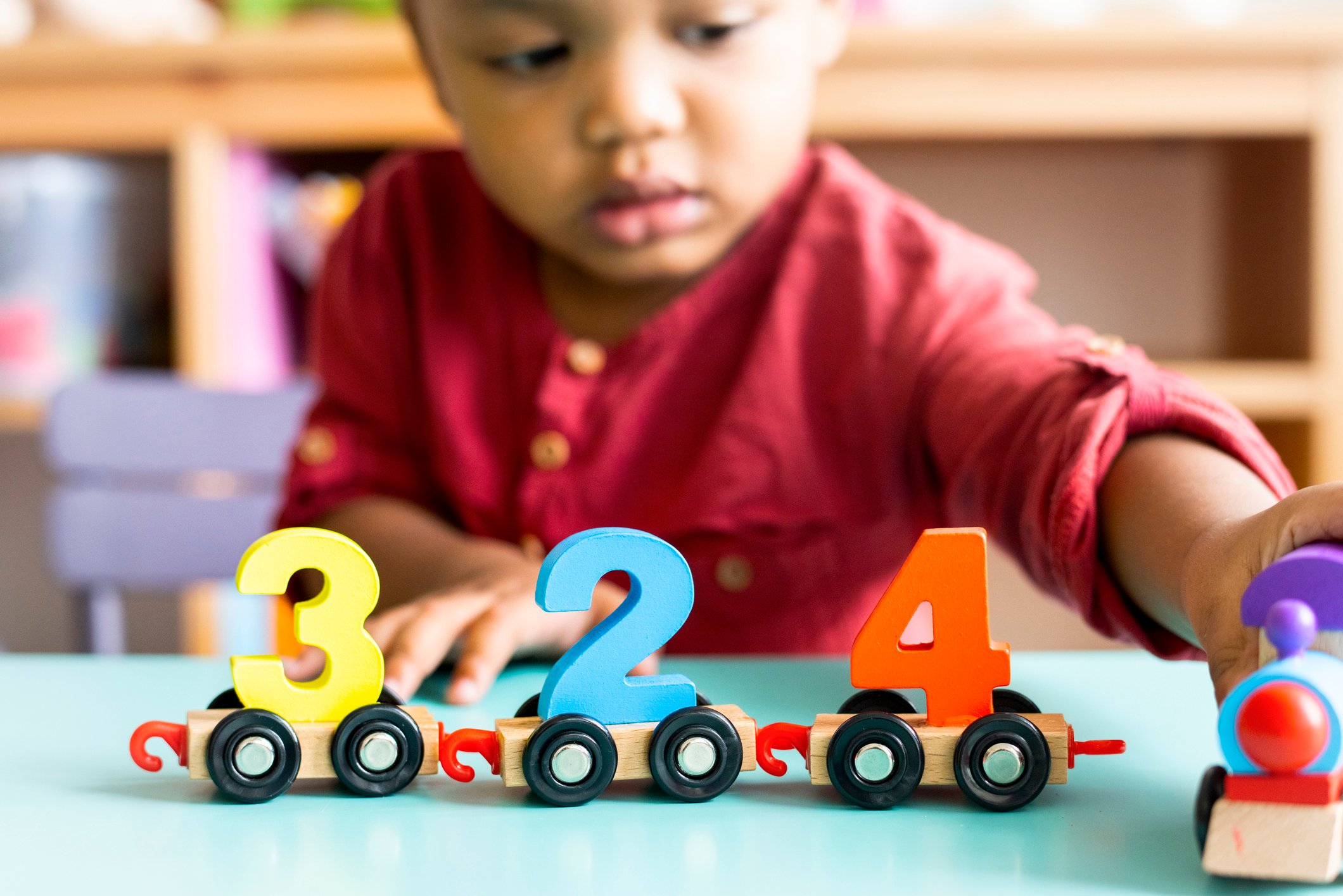 child playing numbers toy