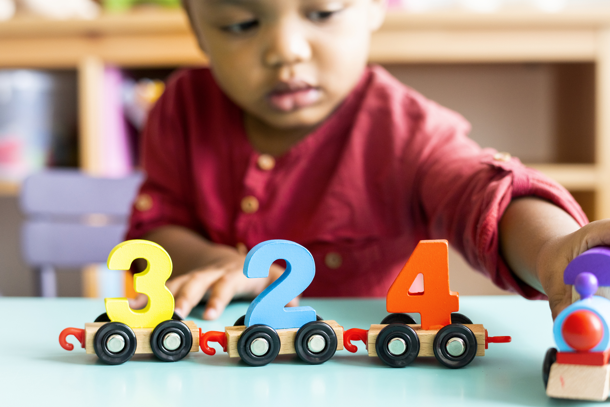 child playing numbers toy