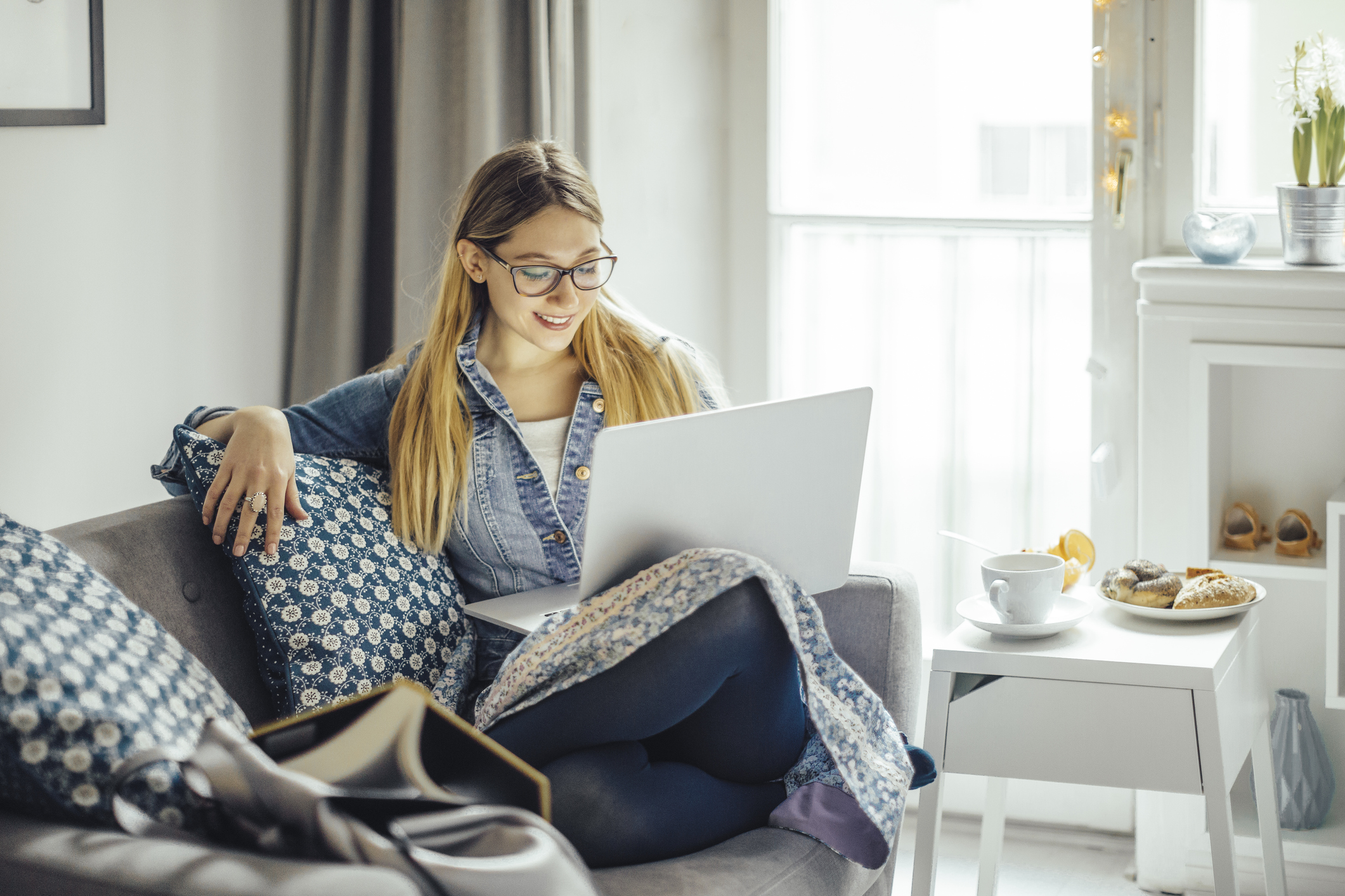 Woman on couch with computer
